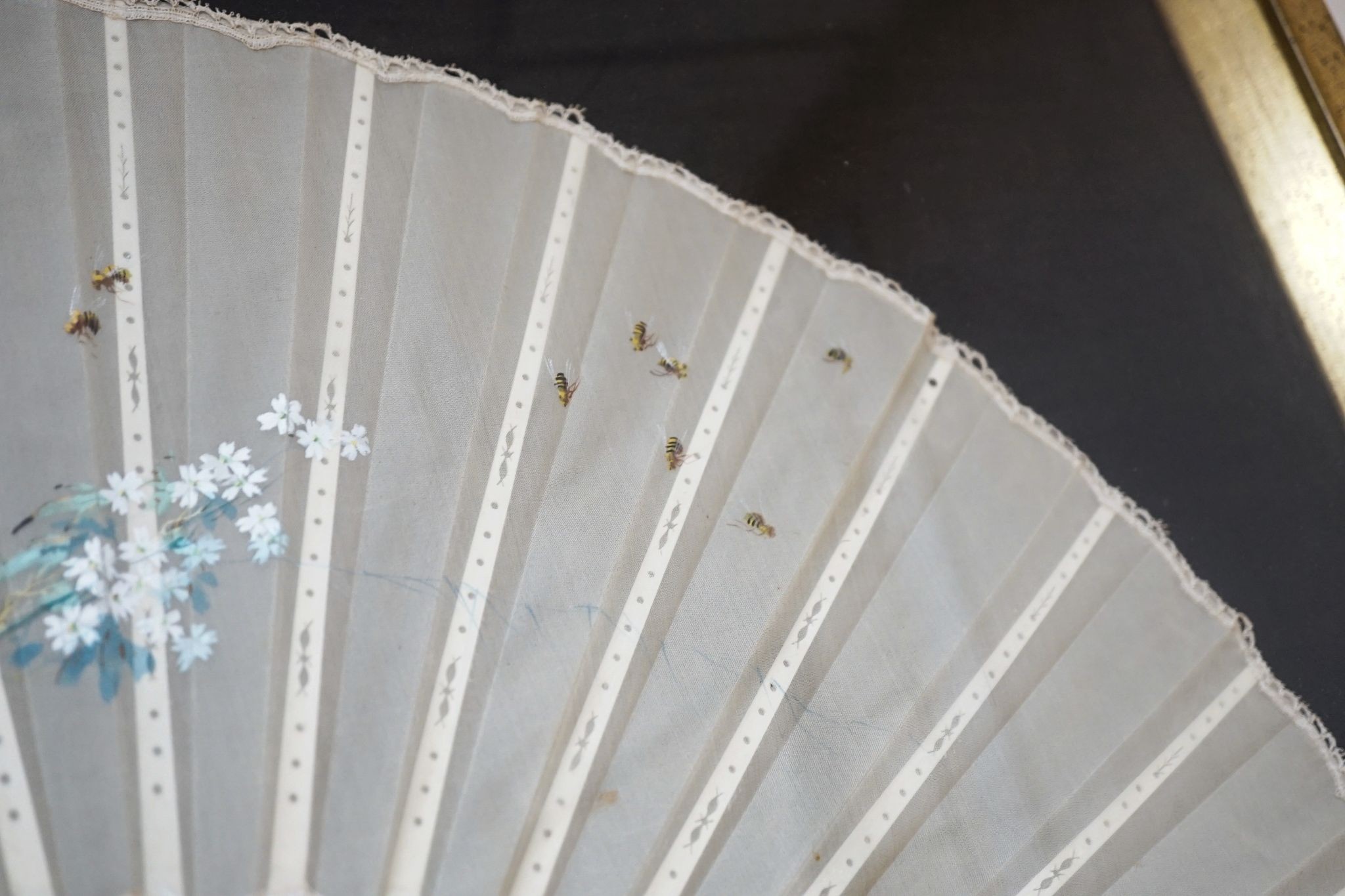 A framed 19th century French mother of pearl and painted silk fan, approx. 60cm long excl frame